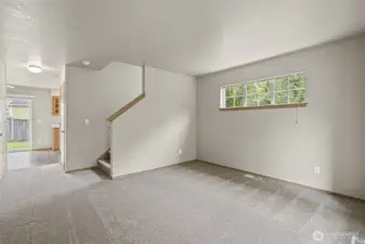 Living room on main level, looking towards kitchen.