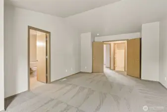 French doors open to oversized primary bedroom on the second floor