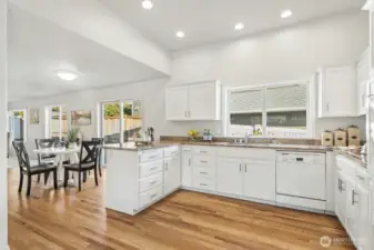 Informal dining room can be expanded toward the family room for larger gatherings.