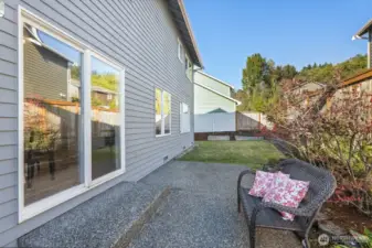 Fully fenced backyard with patio and lots of garden and/or play area.