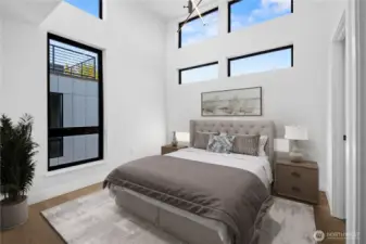 Upper Level Primary Suite.  Photo has been virtually staged and may be an angle from an adjacent unit.