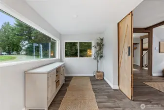 Spacious entry designed as a functional mudroom.