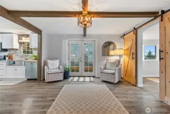 Cozy living area with brand-new windows throughout the home.