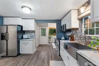 Thoughtfully designed kitchen with generous storage and coffee bar.