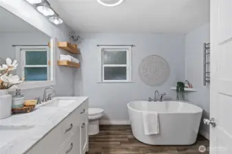 Large bathroom with a luxurious soaking tub.