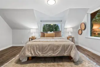 Upstairs primary suite with plenty of space and natural light