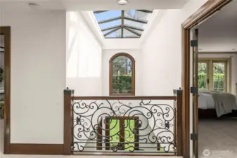 A dramatic linear skylight spanning the length of the home, complete with integrated shading that filters soft natural light throughout.