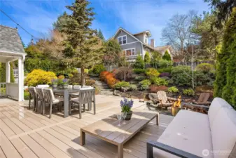 This shows a sunken area with pea gravel suitable for a fire pit gathering area. (this outdoor furniture does not convey).