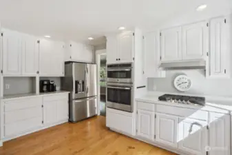 Easy access to the living room, dining room and entrance from the kitchen. See that great gas stove?