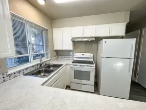 Unit A kitchen, looking stylish with newer designer paint.