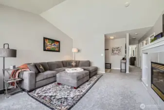 The vaulted ceilings make this space feel gigantic & the fireplace is perfect for cozy winter nights!
