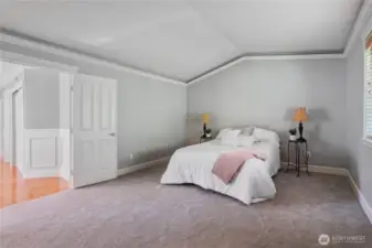 Primary suite with vaulted ceilings.