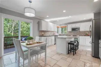 Updated kitchen with eat in space and island seating.