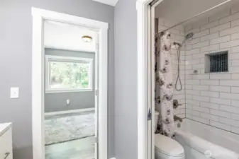 Upper floor full bathroom with seperate tub and toilet.