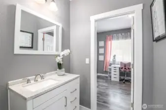 Main floor full bath services both bedrooms.