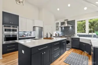 Stunning new kitchen with 2-tone cabinetry and quartz counters.