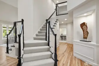 Updated stairway and lighted art niche.
