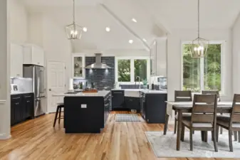 Very tall vaulted ceilings, brushed gold hardware and chandeliers.
