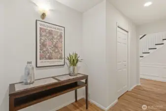 Hallway with guest powder bath and bonus room.