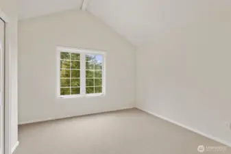 Bedroom 2 upstairs with a vaulted ceiling.