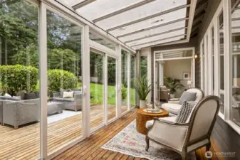 2 sets of French doors lead to the sunroom.