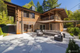Spacious Patio and Deck. Door to lower level primary suite and two doors to lower rec room.