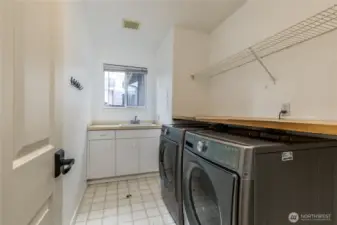 Main level laundry room. Washer & dryer stay!
