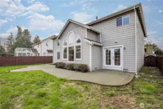 Patio wraps around the back of the home with access from the main kitchen and the secondary kitchenette.