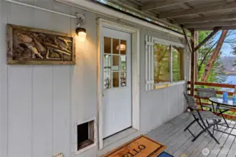 Front door with covered deck area.
