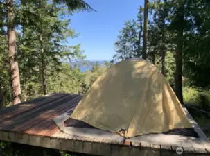 Looking east at tent platform and views beyond. Owner provided photo taken August 2022