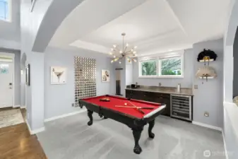 Formal dining off family room with Viking beverage cooler or stunning entertaining space!  Coved ceilings and designer light fixture!