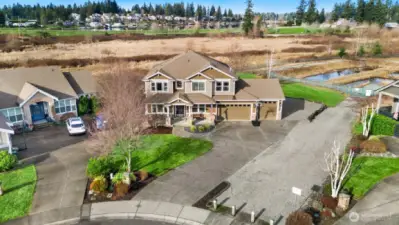 Perfectly located at the end of a cul de sac backing up to wetlands.  This lot features additional parking on the side, four car garage with storage!