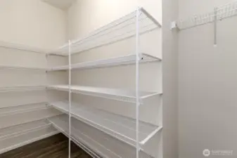 This is the large and spacious walk in pantry just across from the built in desk.