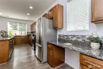 Hardwood laminate floors and stainless steel appliances.
