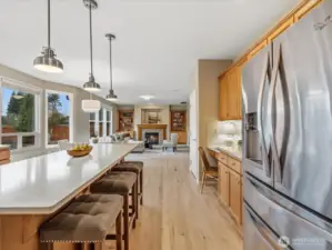 Equipped with Bosch double oven, Bosch range, and Bosch dishwasher, and a large central island.