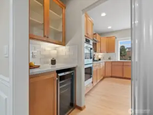 The pass through features a wine fridge.
