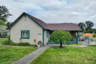 Beautifully manicured yard with mature landscaping all around.