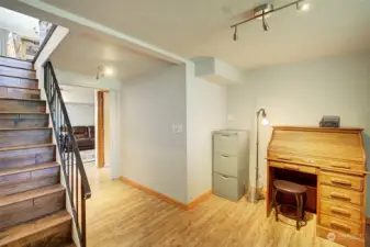 Hardwood on the stairs leading to the lower level.  This area is perfect as office space.