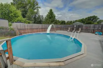 Above-ground pool with composite decking built around it.  Can you imagine all the fun you could have out here?