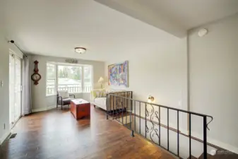 Living room has a nice bay window and a slider that leads to the upper deck.