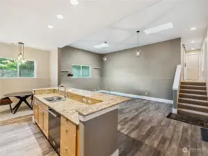 Kitchen looks out into the great room. Up those stairs is a full-bath and two very spacious bedrooms.