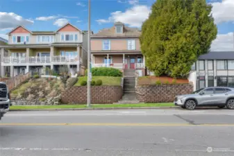 Street view of the Duplex with a large covered front porch.