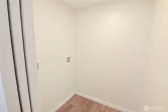 The laundry room is next to the 2 lower bedrooms.