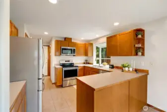 Modern, efficient kitchen with stainless appliances.