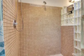 Tiled walk in shower in primary