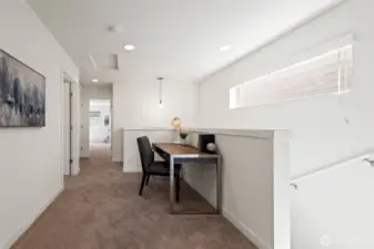 Upstairs loft with writing desk – ideal for work or study.