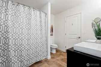 Second upstairs jack and jill bathroom that opens to both adjoining bedrooms