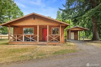 Looking at this cedar cabin with the carport and cedar-lined storage room that is just off the back door at the laundry room.