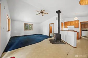 Looking across the spacious living room with the primary bedroom beyond.