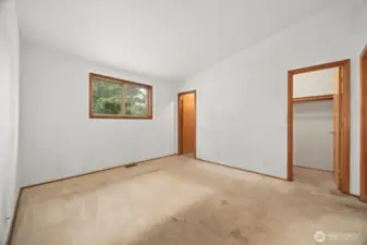The bedroom has two walk-in closets. The carpet needs to be replaced.